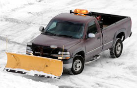 A truck plowing snow